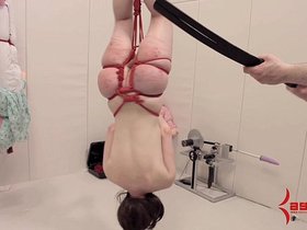 Anal masochist hung upside down and abused